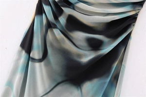 Detailed view of Y2K floral mesh fabric with artistic ruching and semi-sheer texture