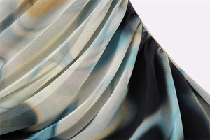Detailed close-up of Y2K floral print mesh fabric with intricate pleated textures