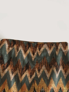 Detailed view of Y2K high-waisted skirt featuring colorful zigzag geometric print patterns