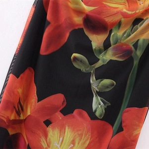 Y2K floral print mesh tube dress in black with vibrant orange lily patterns