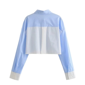 Detail of blue and white striped patchwork cropped long-sleeve shirt with cuffs