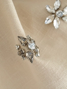 Detailed macro view of pear-cut rhinestones and silver crystal beads on a sequin skirt