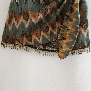 Y2K bohemian high-waist skirt with chevron patterns and beaded fringe tassel hem