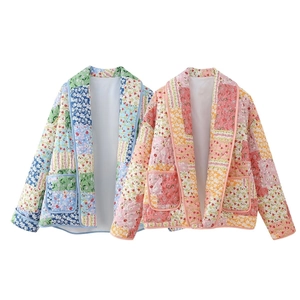 Detail of quilted floral jackets with patchwork design and front pockets in blue and orange
