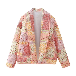 Detail of floral patchwork quilted jacket with contrast colors and lapel design