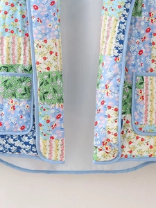 Y2K vintage floral patchwork quilted vest with blue trim and double front pockets