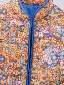 Gilet matelassé fleuri Y2K avec base orange et bordure bleue à col montant chic