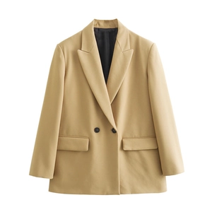 Detail view of light khaki blazer showing classic lapels and two black buttons on flat lay