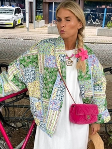 Women's Y2K vintage patchwork quilted jacket with floral patterns and an open front style