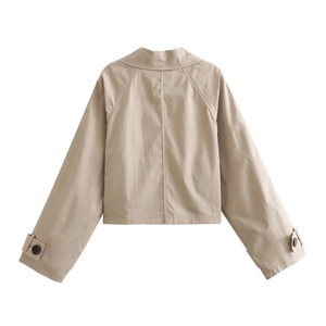 Rear view of light khaki short windbreaker showing raglan sleeves and buckled cuff details