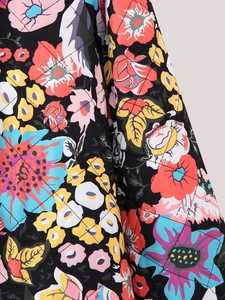 Macro view of Y2K floral print fabric with diamond quilting on black padded jacket
