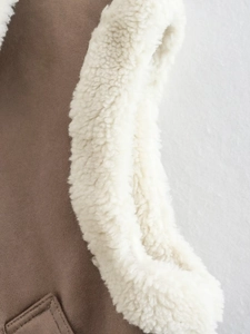 Detail view of brown suede fabric and soft faux lamb wool lining on a winter vest coat