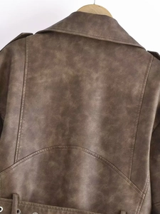 Rear view of brown vintage washed faux leather jacket with epaulettes and belted hem