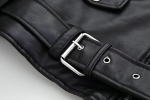 Macro shot of silver square buckle and metal eyelets on black Y2K faux leather jacket