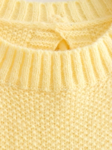 Y2K fashion yellow sleeveless knit vest with ribbed crew neck and honeycomb texture