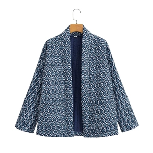 Detail view of ethnic geometric print jacket showing inner lining and size S neck label