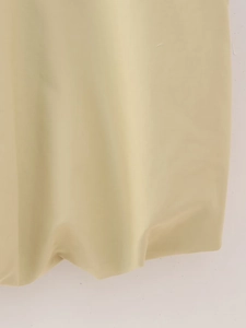 Detailed close-up of light beige y2k vest fabric showing fine woven texture and soft folds