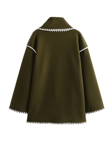 Deep green oversized wool coat with white zigzag stitching details shown from the back