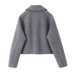 Back view of a grey short tweed jacket with textured wool fabric and a lapel collar design