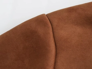 Detailed close-up showing the fine texture and stitching of brown suede y2k jacket fabric