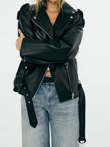 Women's oversized black faux leather biker jacket with multiple zippers and wide lapels