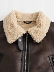 Brown Y2K faux leather biker jacket with white sherpa collar and metal zipper detail