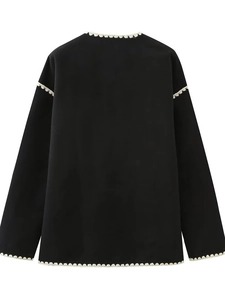 Women's black wool coat with white scalloped embroidery and matching scarf detail