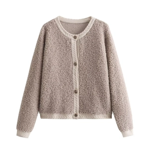 Detailed view of deep mauve sherpa fleece cardigan with cream contrast trim and vintage buttons