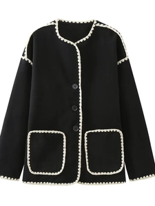 Women's elegant black wool coat with white crochet lace trim and decorative front pockets