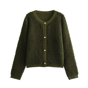 Detail of dark green knit cardigan with gold embossed buttons and textured boucle fabric