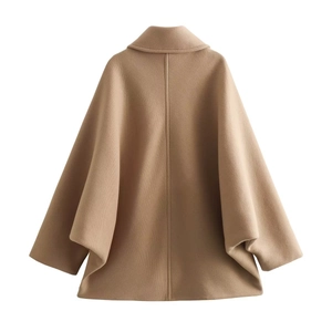 Back view of camel wool cape coat showing loose batwing sleeves and premium texture