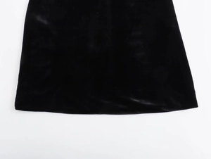 Detailed close-up showing the soft texture and hemline of a black Y2K velvet dress