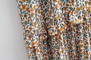 Detail shot of the ruffled layers and floral print fabric on the summer slip dress