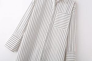 Detailed macro shot of striped shirt showing vertical patterns and horizontal pocket detail