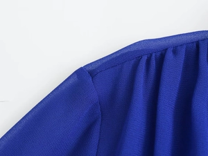 Close-up of royal blue chiffon blouse showing fine shoulder pleats and sewing details