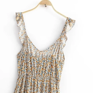 Floral ruffle strap sundress with smocked waist and delicate yellow blue petal prints