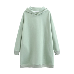 Detail of oversized light green cotton hoodie featuring a drop shoulder and clean stitching