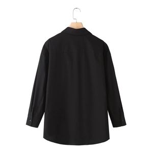 Minimalist black poplin long sleeve shirt featuring drop shoulders and curved hem back view