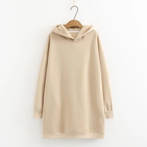 Detail of oversized beige hoodie featuring ribbed cuffs and soft fleece cotton texture