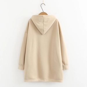 Oatmeal color oversized hoodie back view with ribbed cuffs on wooden hanger