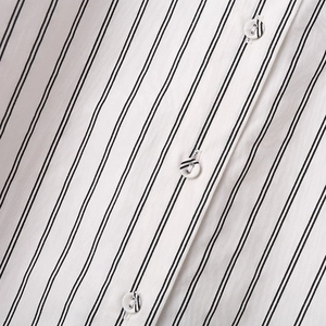 Classic vertical striped shirt with matching decorative buttons in a loose Y2K fashion style