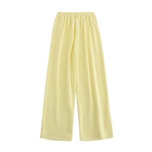 Vue détaillée du pantalon large jaune clair avec taille haute élastique confortable