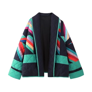 Close-up of quilted texture and colorful geometric print on a V-neck long sleeve jacket