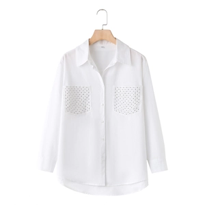 Detailed view of women's white poplin shirt with rhinestone-embellished chest pockets