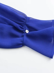 Royal blue long sleeve shirt featuring ruffled cuffs and a delicate white button detail