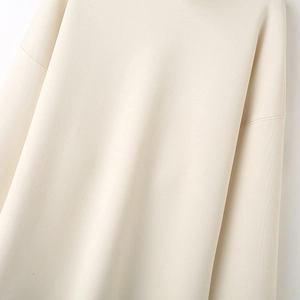 Minimalist Y2K ribbed white sweatshirt for women showing high-quality shoulder stitching
