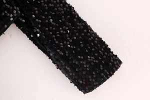 Macro shot of high-density black sequins on a premium velvet top fabric with fine stitching