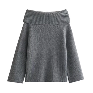 Detail of dark grey knit sweater showing off-shoulder collar and ribbed texture