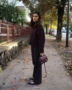 Close-up of deep brown wool cropped jacket with single-breasted design for autumn look