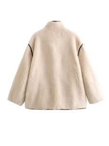 Back view of cream oversized fuzzy fleece jacket with brown contrast piping details